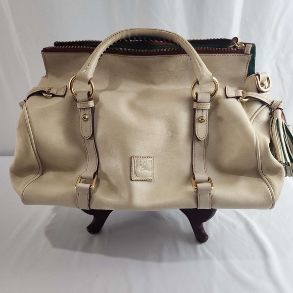Dooney & Bourke cream leather handbag. Used with minor wear